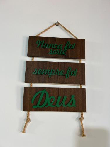 a sign for a drug store with the words masyasy for north and someone at Rancho do Léo in Conceição do Mato Dentro