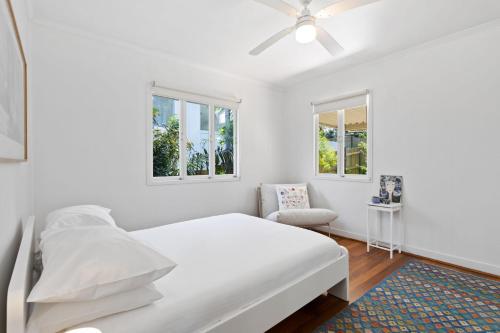 Ένα ή περισσότερα κρεβάτια σε δωμάτιο στο Charming Queenslander Getaway