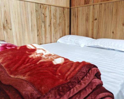 Ένα ή περισσότερα κρεβάτια σε δωμάτιο στο Thu May Homestay Anor A Lưới