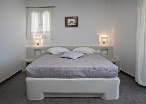 Un ou plusieurs lits dans un hébergement de l'établissement Porto Raphael Residences & Suites