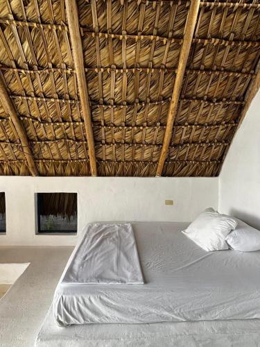 Katil atau katil-katil dalam bilik di Blue Beach Eco-Hotel by Sanfabini