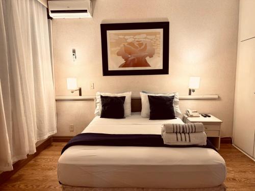 a bedroom with a large bed in a room at 803 - Rentaqui Apartamento Beautiful view Retro in Sao Paulo