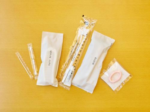 a group of plastic items on a yellow table at Hotel Fukui Castle - Vacation STAY 58682v in Fukui