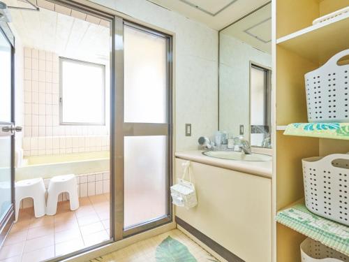 a bathroom with a sink and a mirror at Hotel Fukui Castle - Vacation STAY 58682v in Fukui