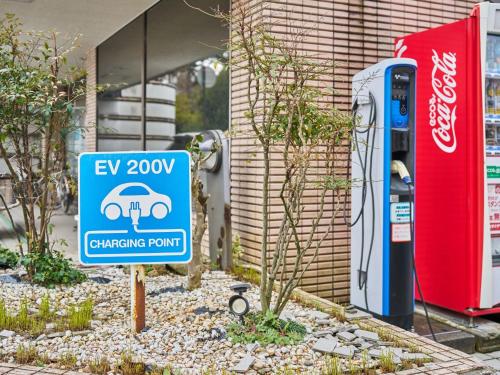a sign in front of a car charging station at Hotel Fukui Castle - Vacation STAY 58682v in Fukui