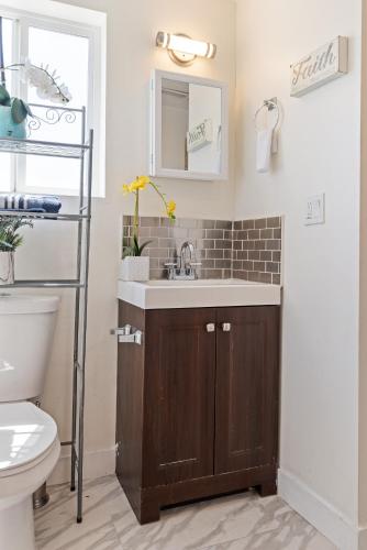 a bathroom with a sink and a toilet at Nice Cozy Home in Oakland