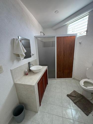 a bathroom with a sink and a toilet at apartment with sea and Island views in Acapulco
