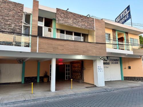a building on the side of a street at Hotel Cañada's & Bungalows in Villa Corona