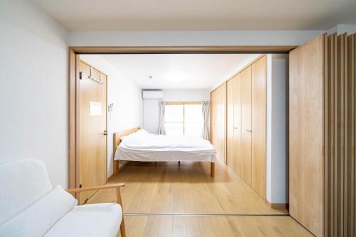 Ένα ή περισσότερα κρεβάτια σε δωμάτιο στο Torikari 5-chome1-10 鳥飼5丁目1-10