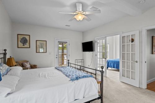 a bedroom with a bed and a ceiling fan at Harkers Haven home in Harkers Island