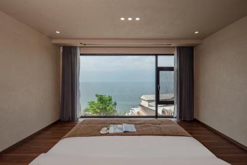 Postel nebo postele na pokoji v ubytování Dali Shuanglang Haiyu Sea View B&B (Double Corridor shop)