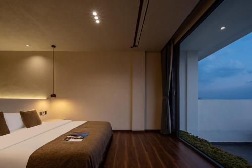 Postel nebo postele na pokoji v ubytování Dali Shuanglang Haiyu Sea View B&B (Double Corridor shop)