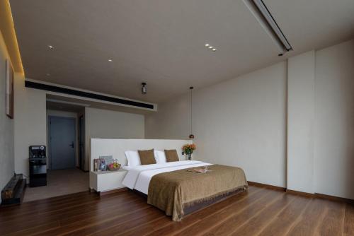 Postel nebo postele na pokoji v ubytování Dali Shuanglang Haiyu Sea View B&B (Double Corridor shop)