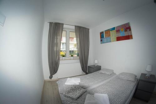 Posteľ alebo postele v izbe v ubytovaní Apartamenty Bursztynowe w Kołobrzegu Sun&Relax