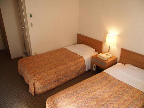 Katil atau katil-katil dalam bilik di Sanside Hotel