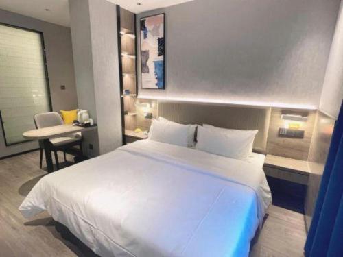 Ένα ή περισσότερα κρεβάτια σε δωμάτιο στο 7 Days Inn Deyang Zhongjiang Kuishan Park