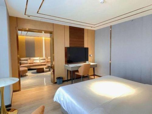 Μια τηλεόραση ή/και κέντρο ψυχαγωγίας στο 7 Days Inn Deyang Zhongjiang Kuishan Park