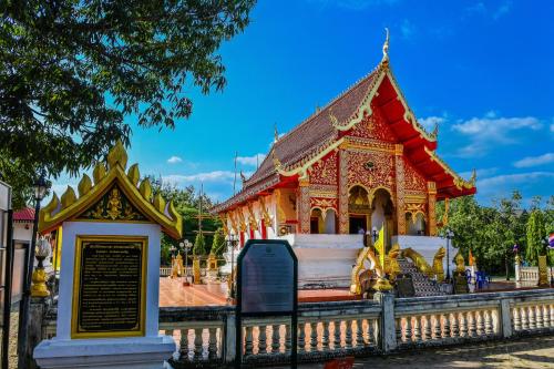 a small building with a sign in front of it at Antiya Hotel Phuket in Phuket Town