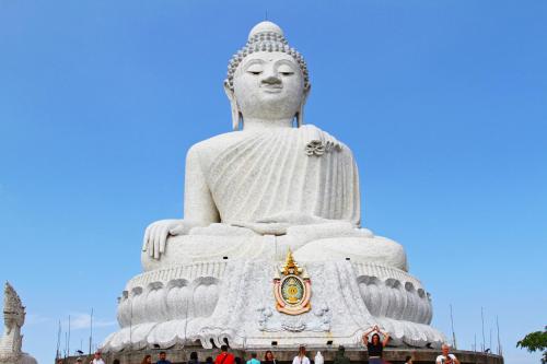 a large statue of avalokitesvara in a park at Antiya Hotel Phuket in Phuket Town
