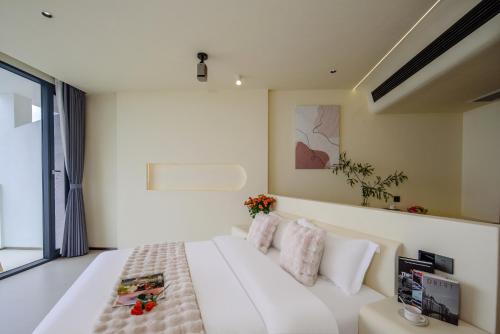 Postel nebo postele na pokoji v ubytování Dali Shuanglang Haiyu Sea View B&B (Double Corridor shop)