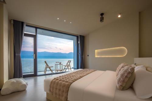 Postel nebo postele na pokoji v ubytování Dali Shuanglang Haiyu Sea View B&B (Double Corridor shop)