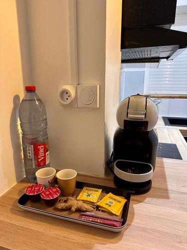 a tray with cups and a coffee maker on a table at moroco in Pointe-à-Pitre