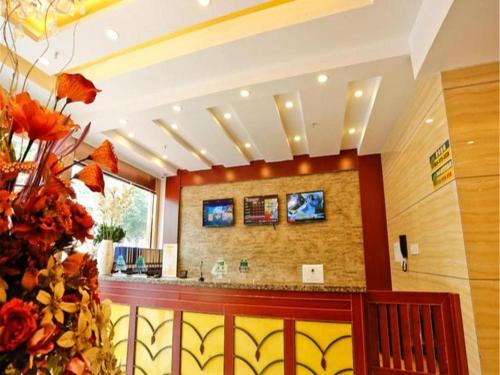 a lobby with a bar in a building at GreenTree Inn Nanjing Confucius Temple Sanshan Street Subway Station Express Hotel in Nanjing