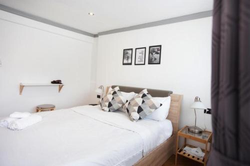 Postel nebo postele na pokoji v ubytování Oh Boutique Guesthouse.