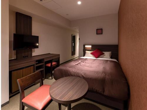 Кровать или кровати в номере HOTEL BAYGULLS