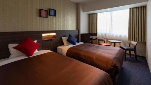 Кровать или кровати в номере HOTEL BAYGULLS