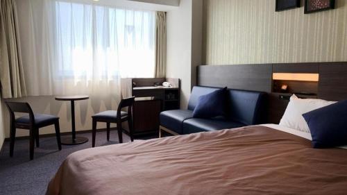 Кровать или кровати в номере HOTEL BAYGULLS