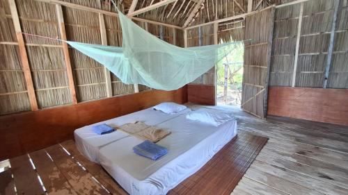 Кровать или кровати в номере Raja Ampat Lovely homestay
