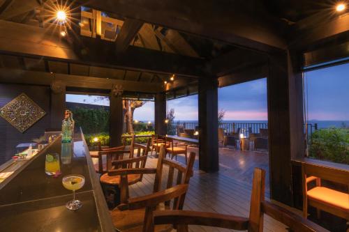 a restaurant with a view of the ocean at Phi Phi Holiday Resort, Leam Tong Beach in Phi Phi Don