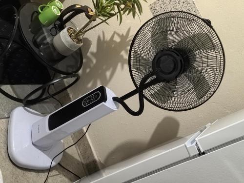 a fan sitting on top of a refrigerator at samama guesthouse in Groblersdal