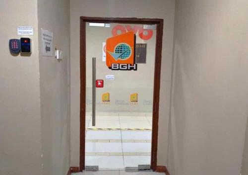a door in a building with a sign on it at BANGI GATEWAY HOTEL in Kuala Lumpur