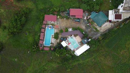 an aerial view of a house with a swimming pool at Pilot Hotel in Alaminos