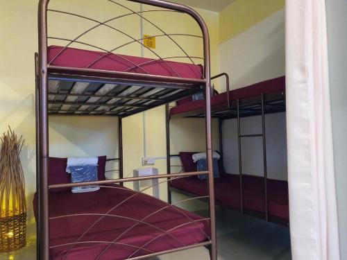 a couple of bunk beds in a room at Hotel O Arriva Travellers in Kuching