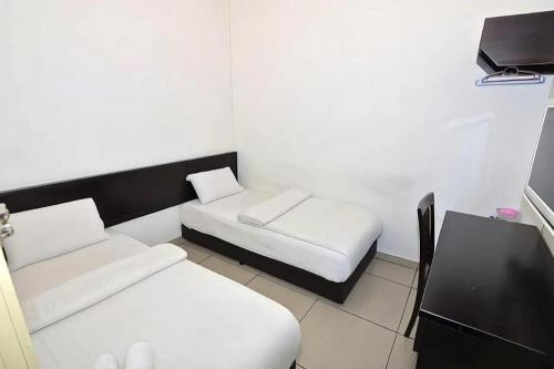 Postel nebo postele na pokoji v ubytování Hotel Alam Indi