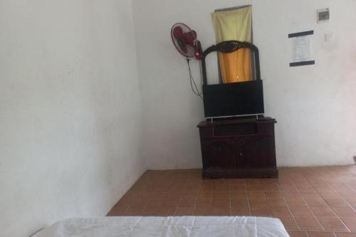 Una cama o camas en una habitación de Hotel O Endj Walet Samodra