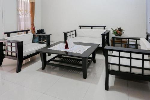 Postel nebo postele na pokoji v ubytování Hotel O Sman House