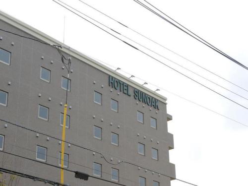 a building with a hotel survey sign on it at Hotel Sunoak Kashiwanoha in Kashiwa