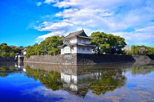 a building in the middle of a body of water at KEIKYU EX INN Hamamatsucho Daimon-Station (Tokyo) in Tokyo
