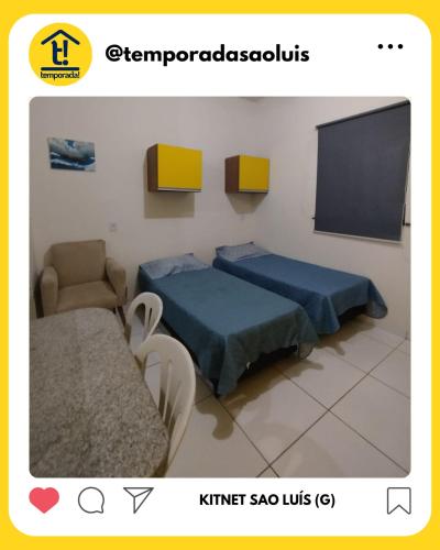 a room with two beds and a tv at Kitnet São Luís - Studio G in São-José-do-Ribamar