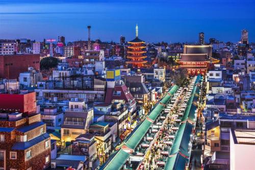 a cityscape of a city at night with buildings at KEIKYU EX INN Tokyo Nihombashi in Tokyo