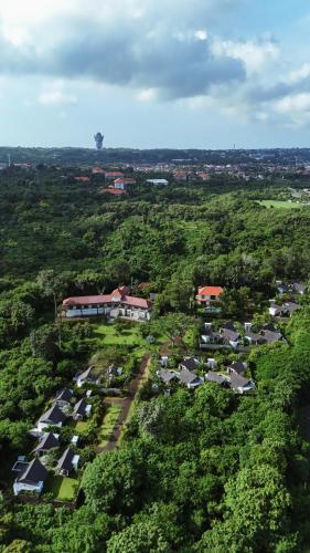 an aerial view of a village with houses and trees at Arpana Luxury Private Pool Villas in Jimbaran