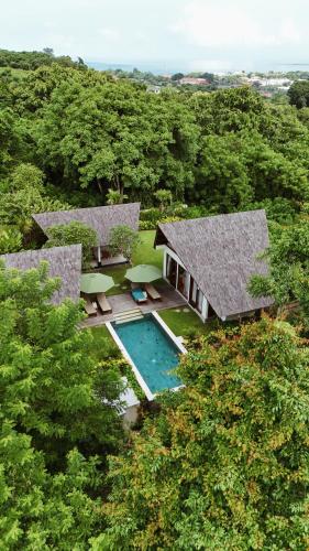 an aerial view of a house with a swimming pool at Arpana Luxury Private Pool Villas in Jimbaran