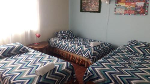 Postel nebo postele na pokoji v ubytování OASIS JENY Apartamento con entrada independiente