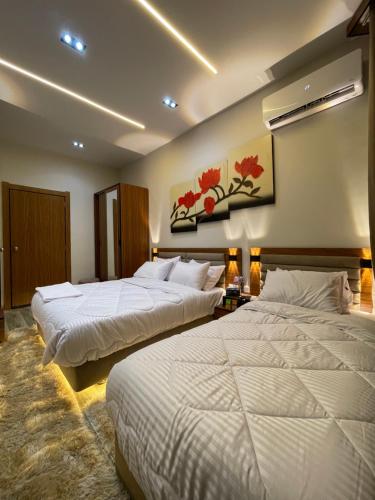 a hotel room with two beds in a room at Italia Hotel cairo in Cairo