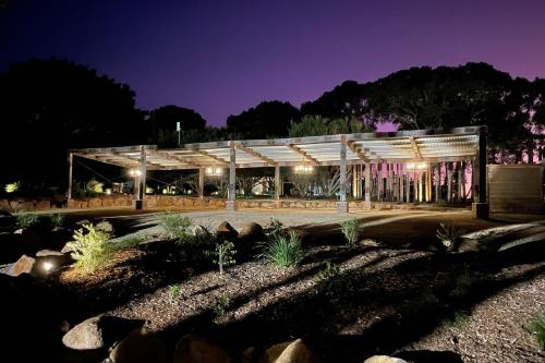 a building is lit up at night at Meadows Estate in Bangalow