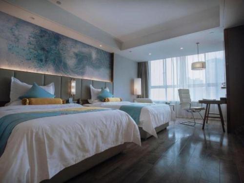 Postel nebo postele na pokoji v ubytování GreenTree Eastern Hotel Suqian Sihong Executive Center